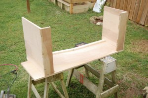 Using L-shaped top and bottom panels means that it's easier to screw them to the sides.